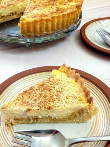 A slice of milk tart on a plate.