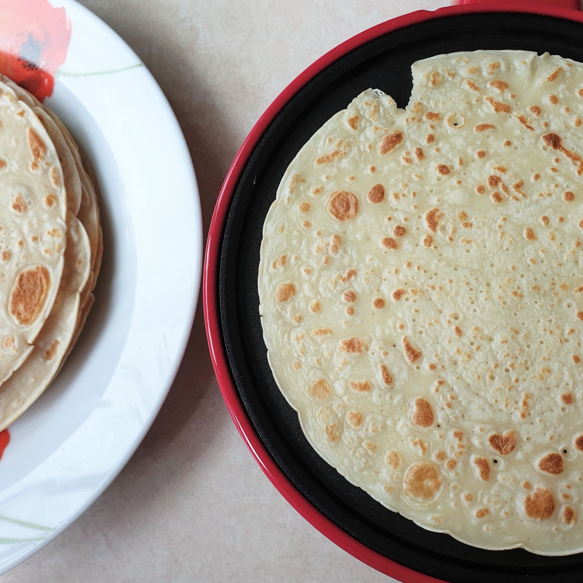 A crepe being fried.