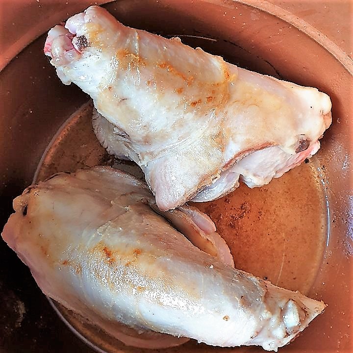 2 lamb shanks being browned