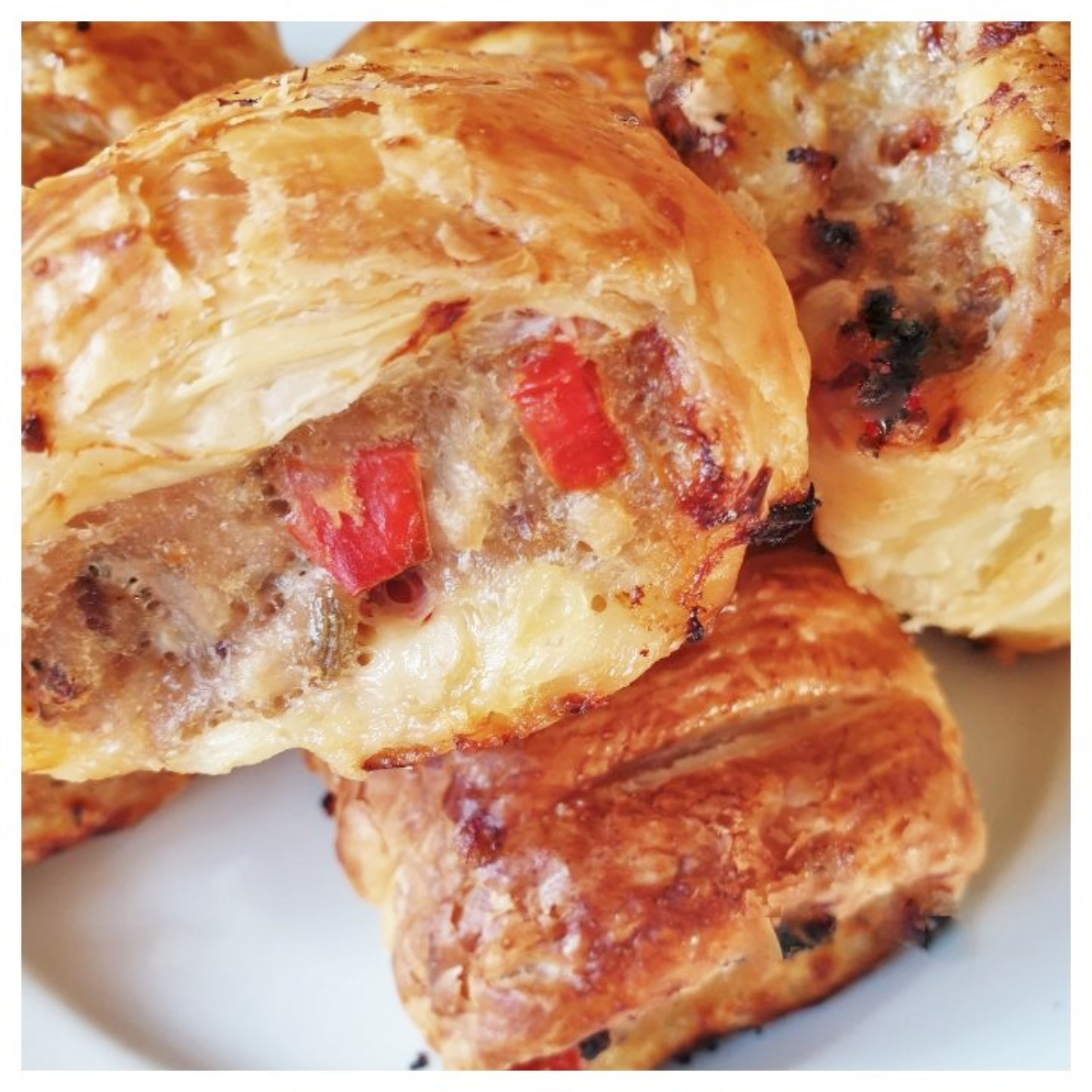 A closeup of the baked pork and apple sausage rolls.