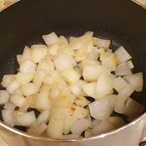 Onions frying in a pan.