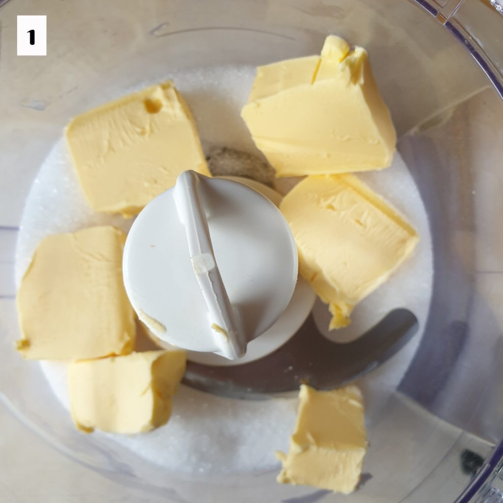 Sugar and butter in a food processor.