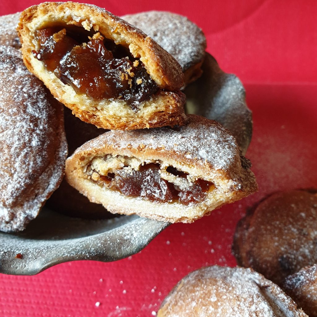A bowl of Christmas mince pies showing inside.
