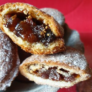 Close up of Christmas mince pies highlighting filling.