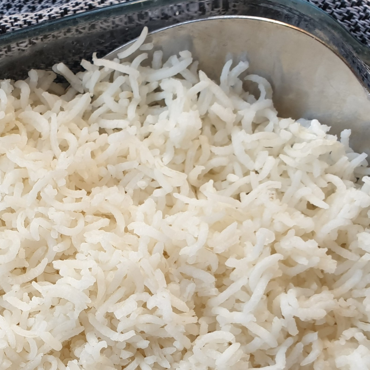 Oven baked rice in a dish with a spoon