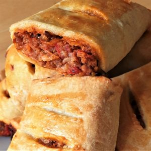 A pile of bolognese sausage rolls.