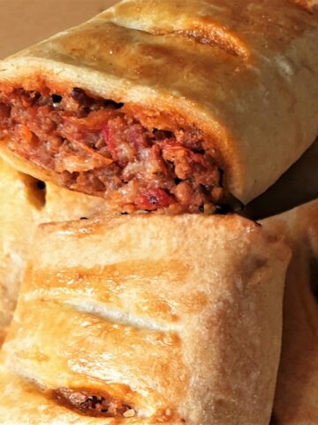 A pile of bolognese sausage rolls.