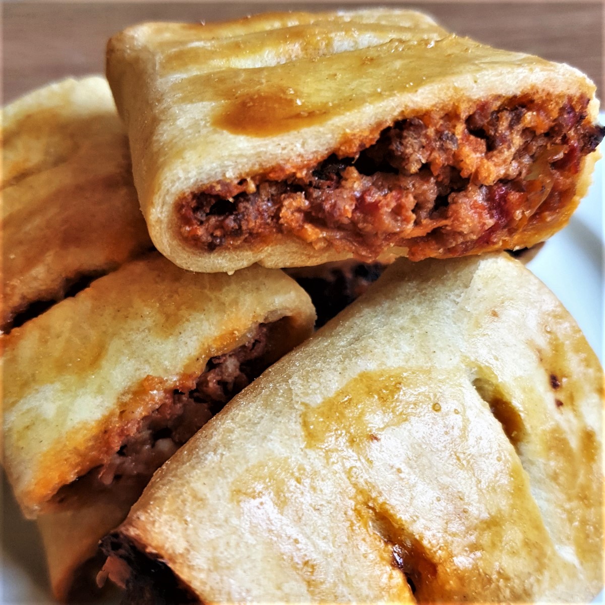 A pile of bolognese sausage rolls.