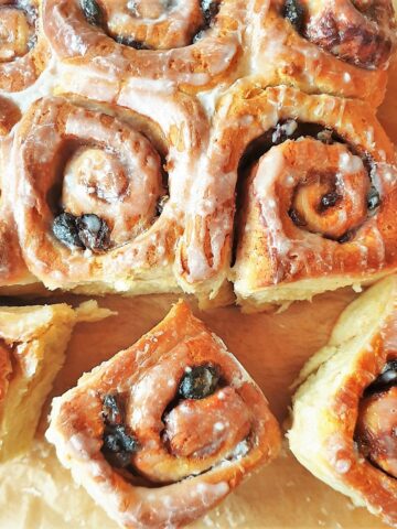 Overhead shot of glazed chelsea buns.