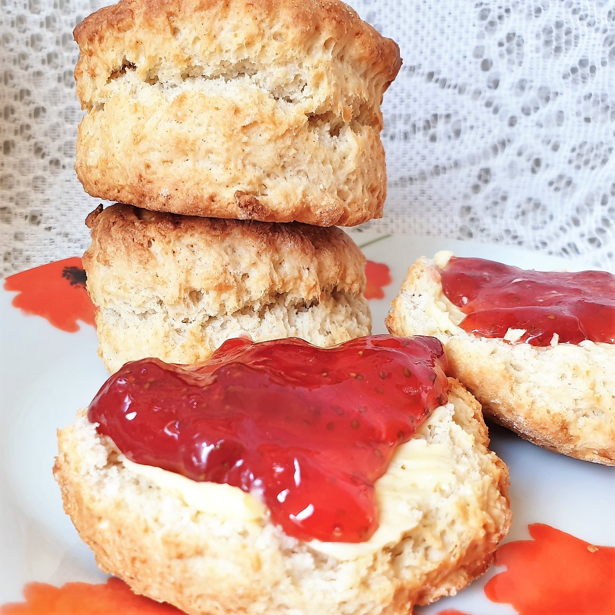 Strawberry jam scones on a plate.