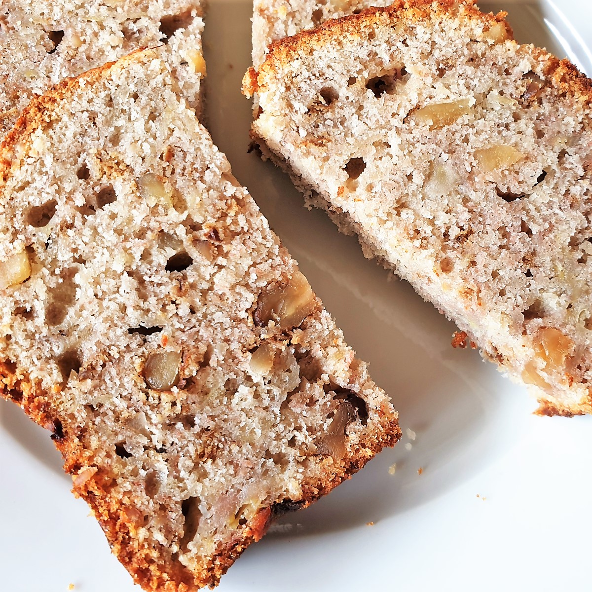 Slices of banana walnut bread on a plate.