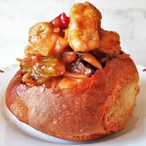 A breadroll filled with garlic chicken stirfry