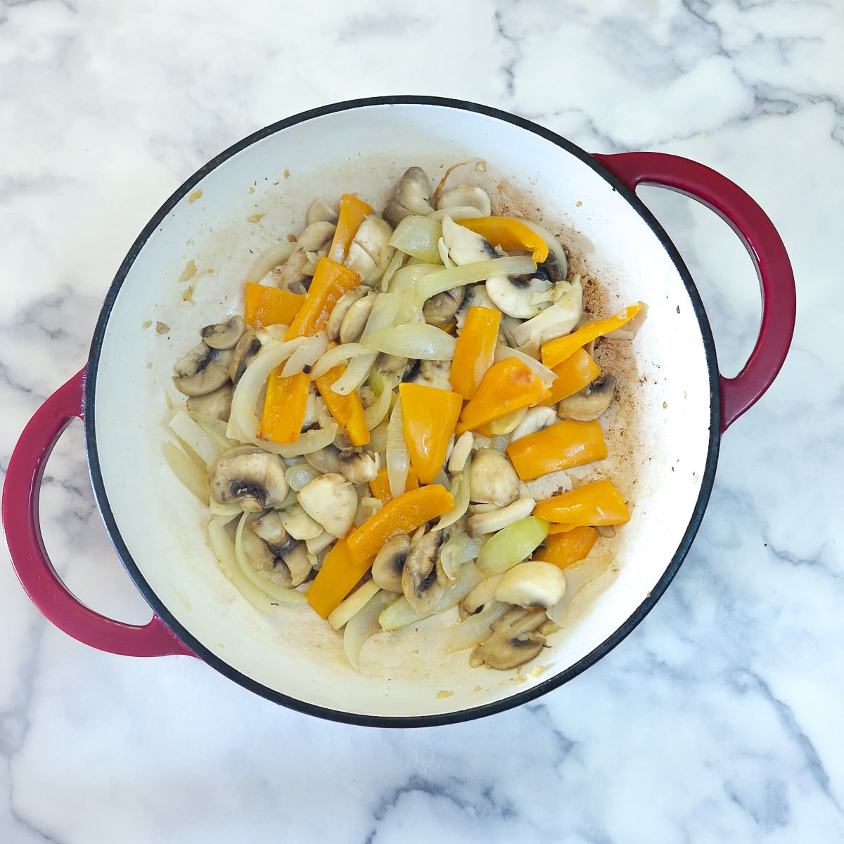 Mushrooms added to the onions and capsicum and left to soften for a few minutes.