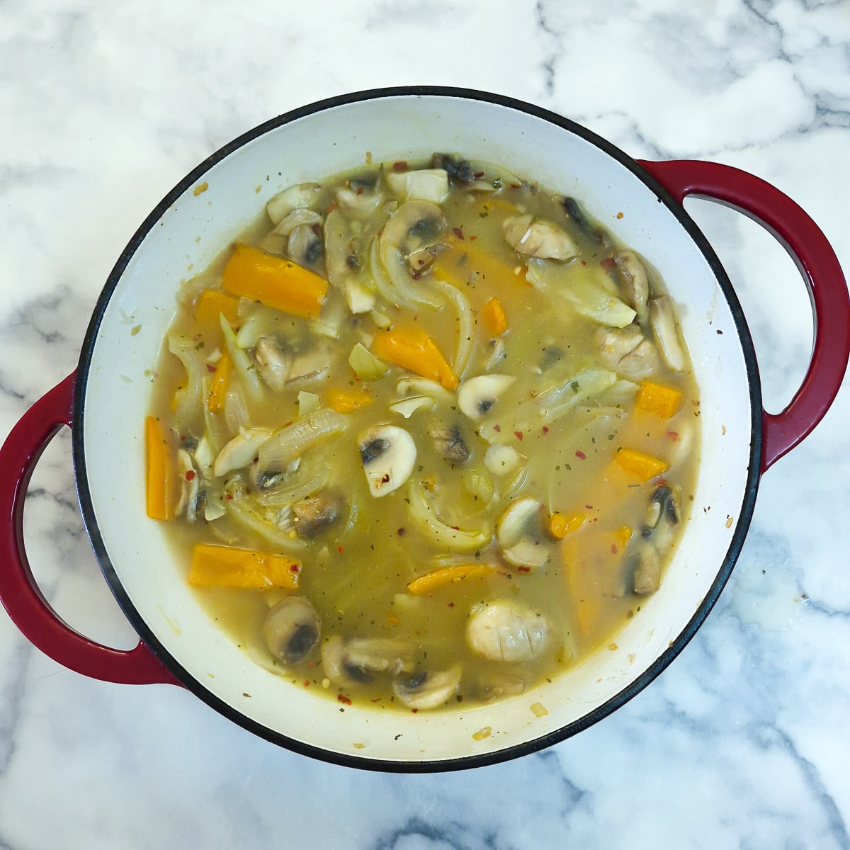 Stock added to the rice and vegetables.