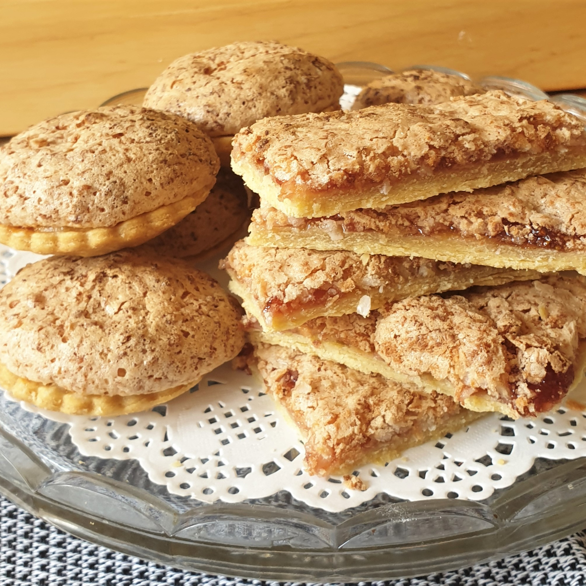 A pile of coconut meringue jam slices.