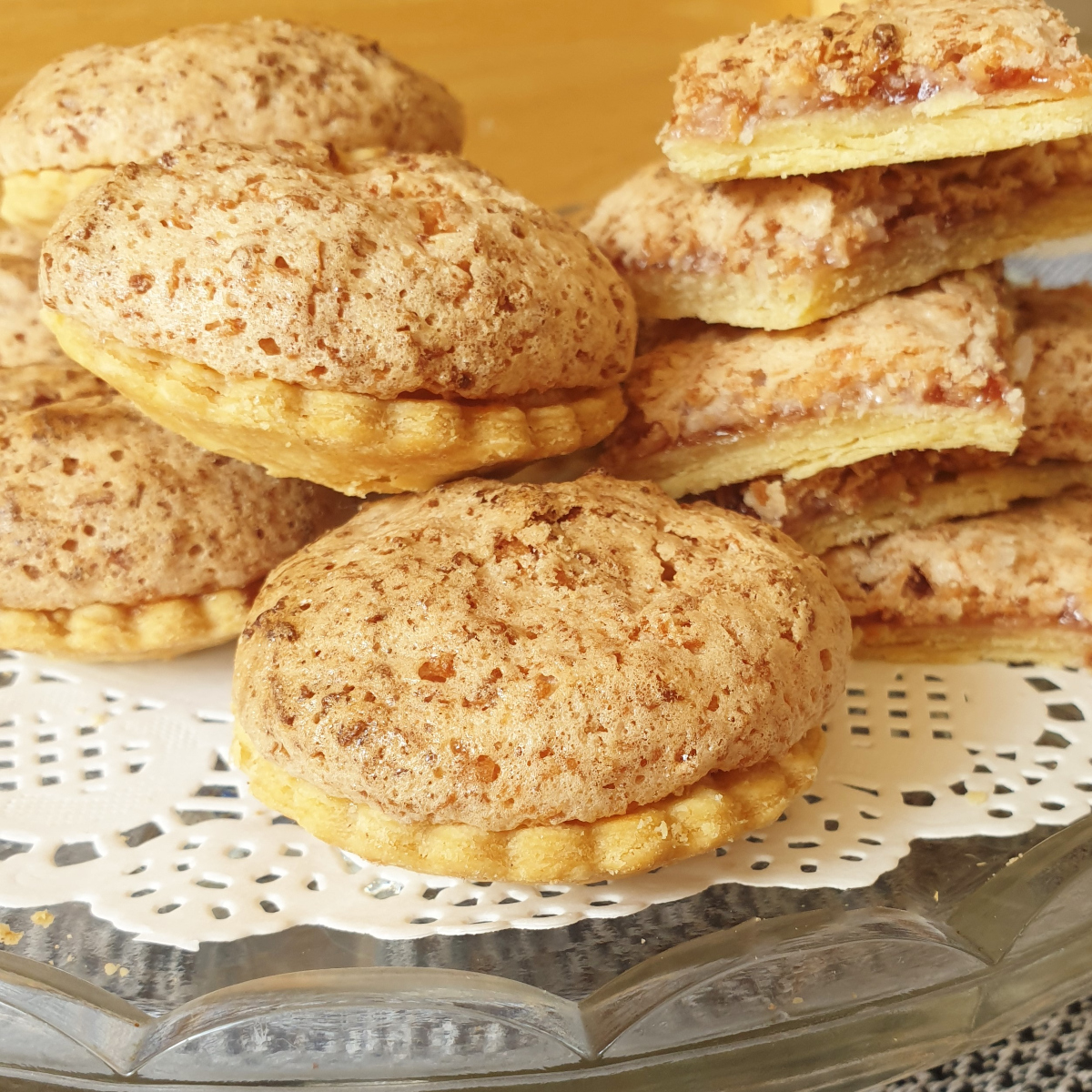 A pile of coconut meringue jam tarts.