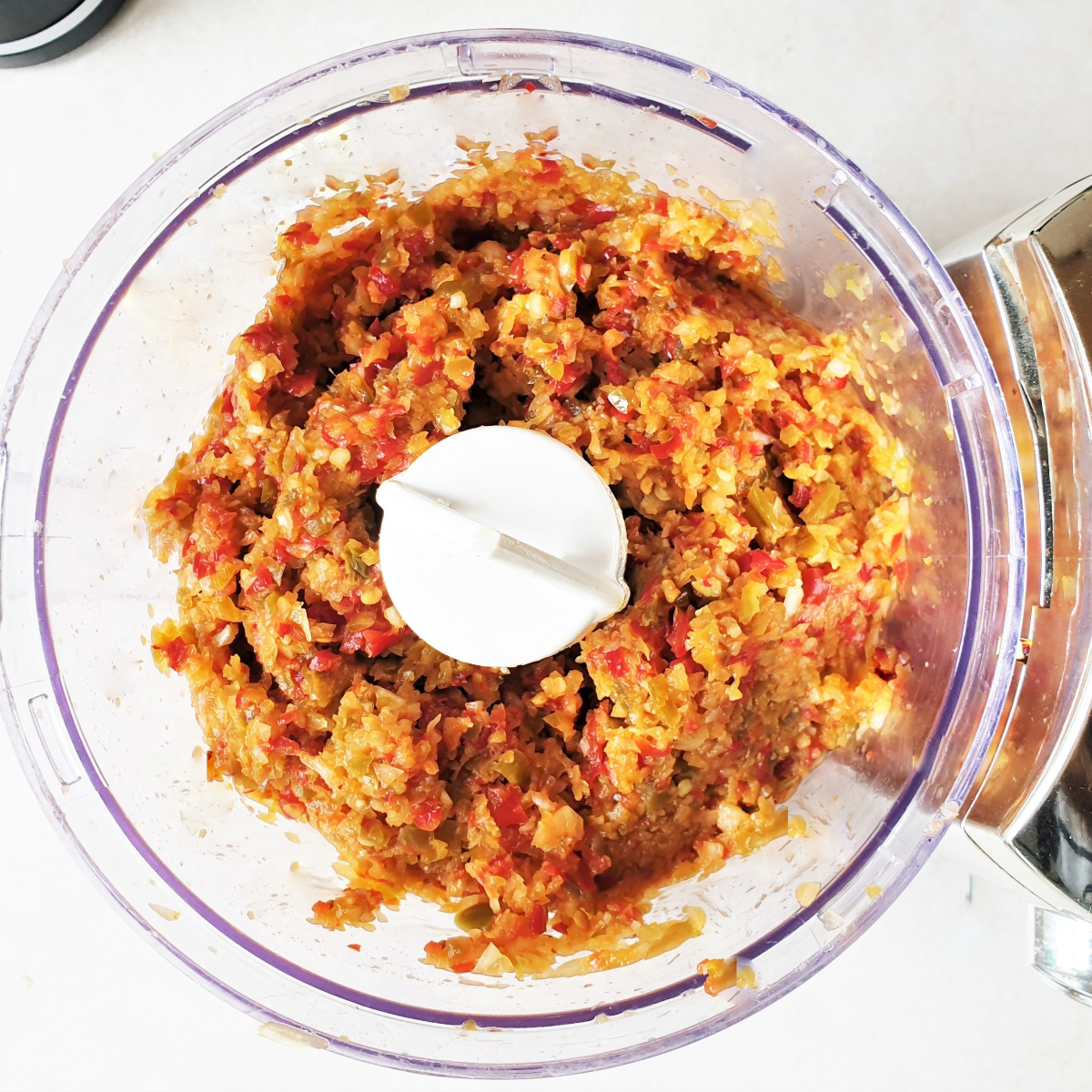 Chili, onion and garlic after being blended in a food processor.