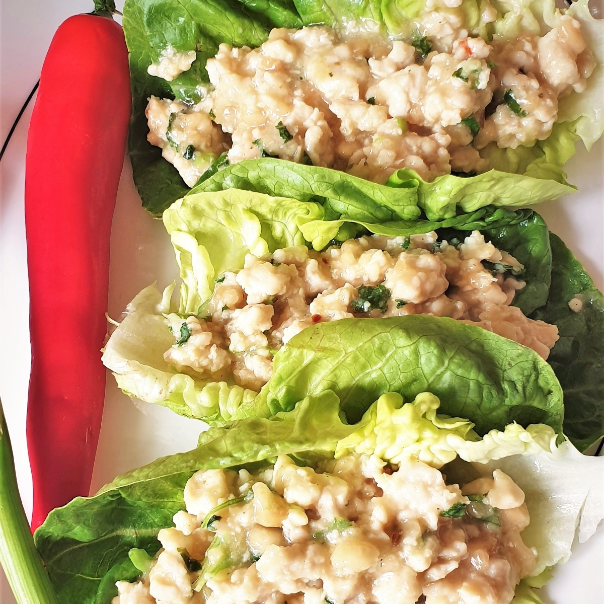 Three lettuce leaves filled with spicy Thai minced chicken.