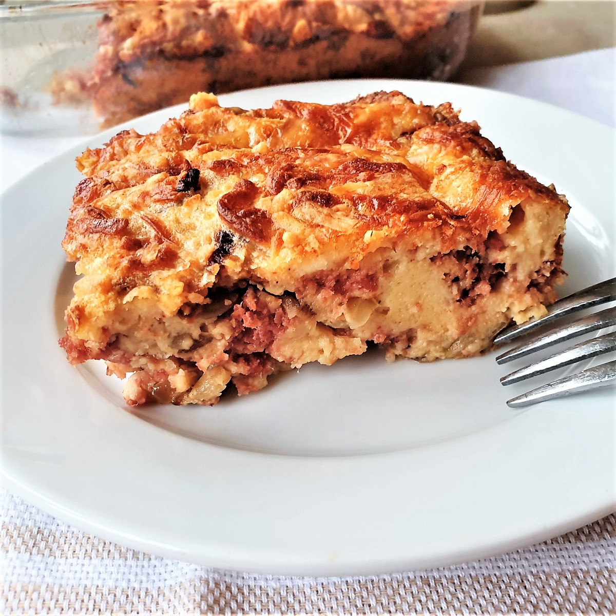 A slice of crustless bully beef quiche on a plate.