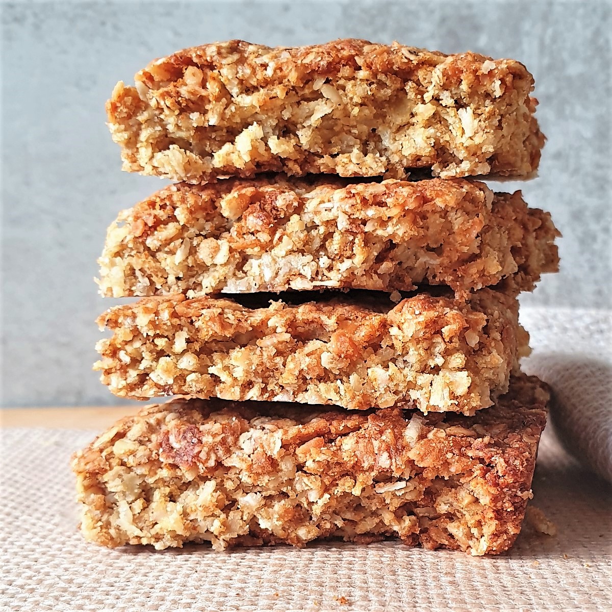 Four crunchies piled on a plate.