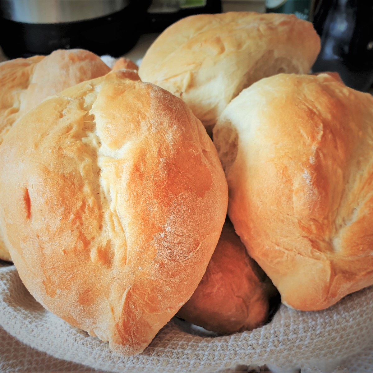 A dish of baked Portuguese rolls.