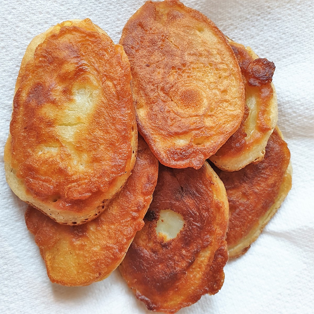 A dish of fried scalloped potatoes.