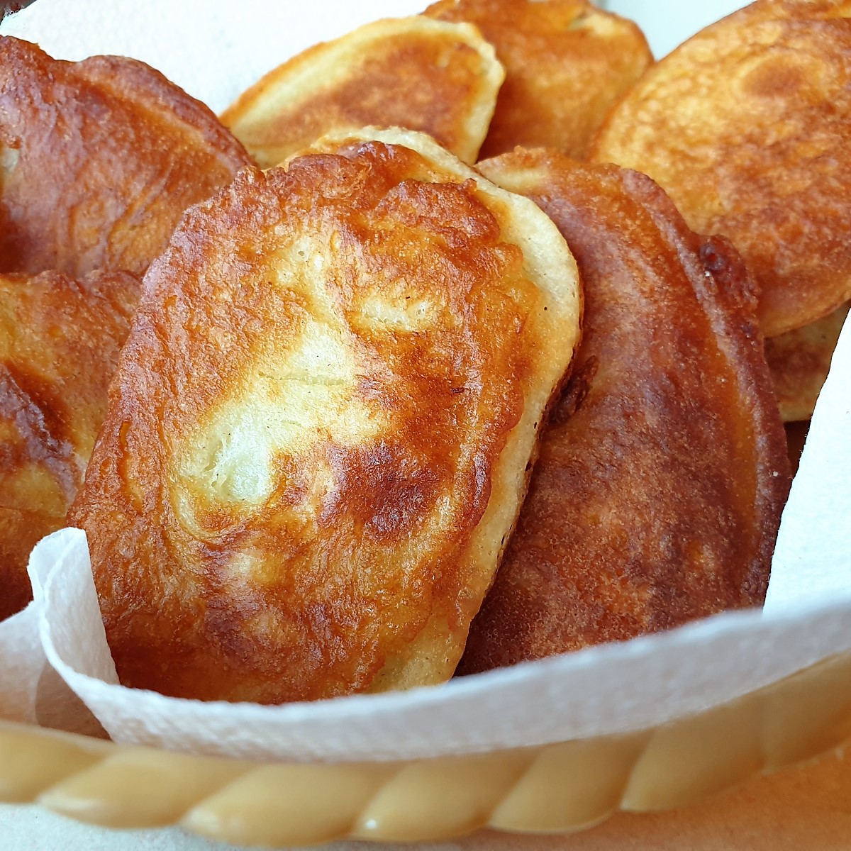 A dish of fried scalloped potatoes.