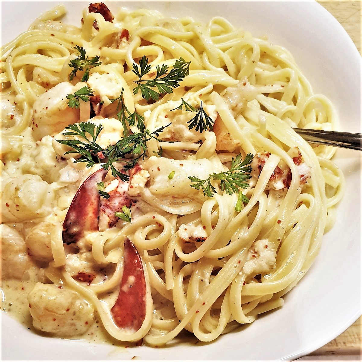 A bowl of creamy seafood linguine.