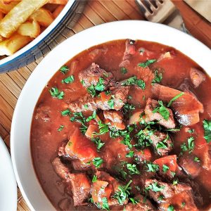 A closeup of a bowl of beef trinchado.