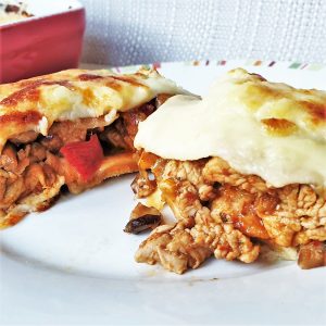 A slice of turkey fajita bake on a plate.