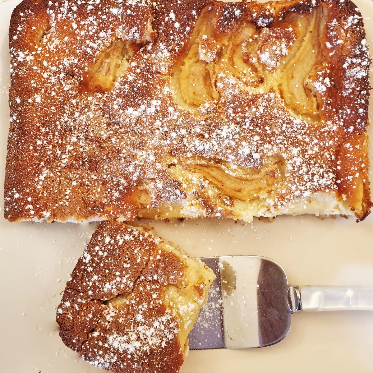 Overhead shot of a tray of fresh pear cream slice.