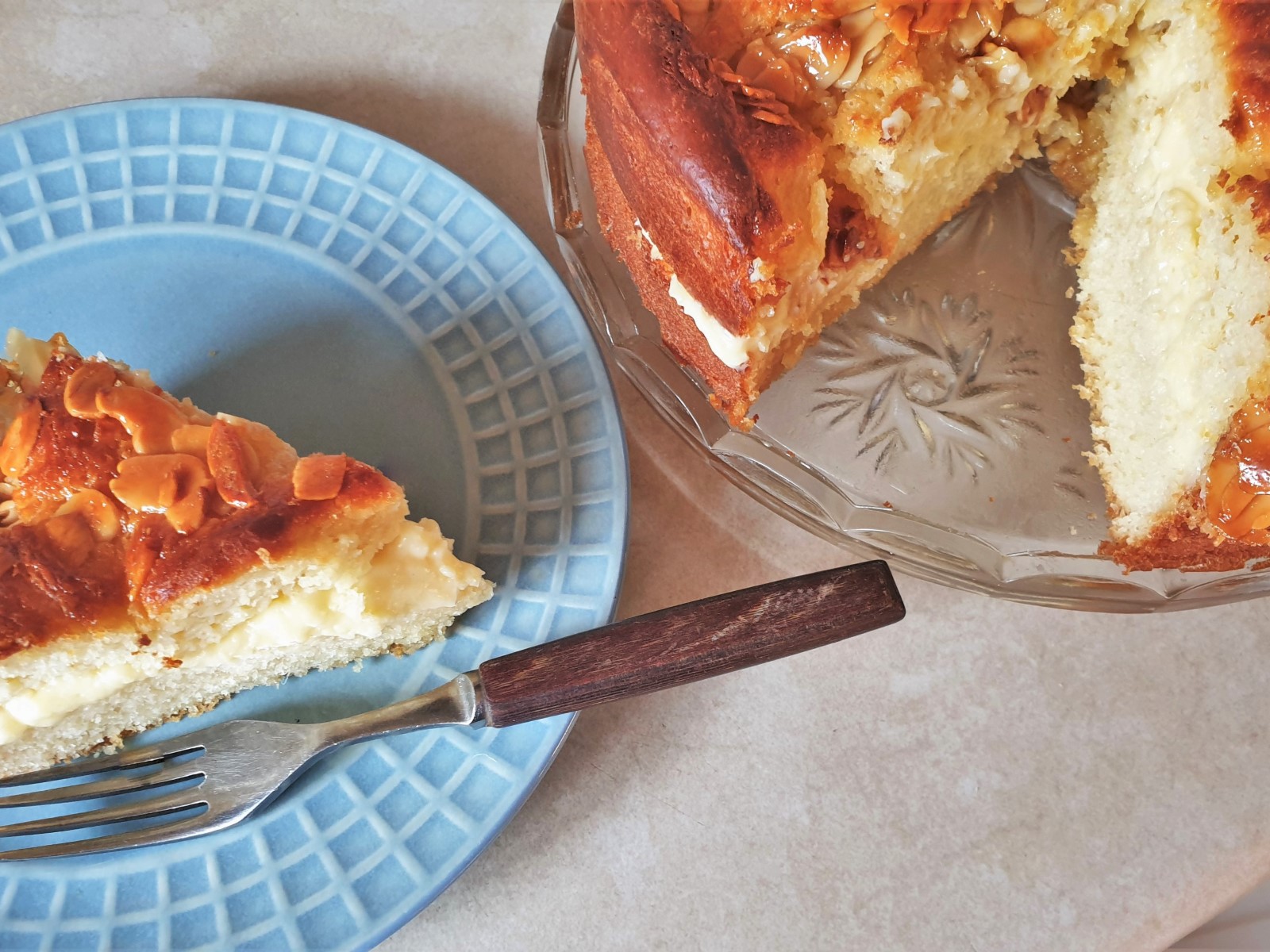 Overhead shot of a slice of bee sting cake cut from the whole cake.