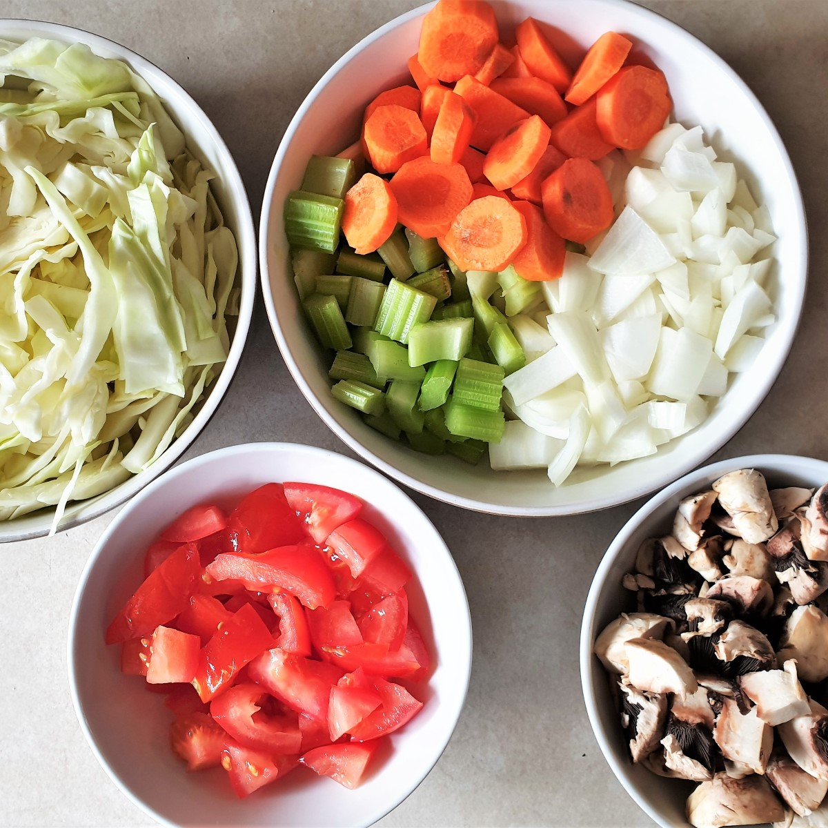 Bowls of chopped vegetables for the meatball soup.