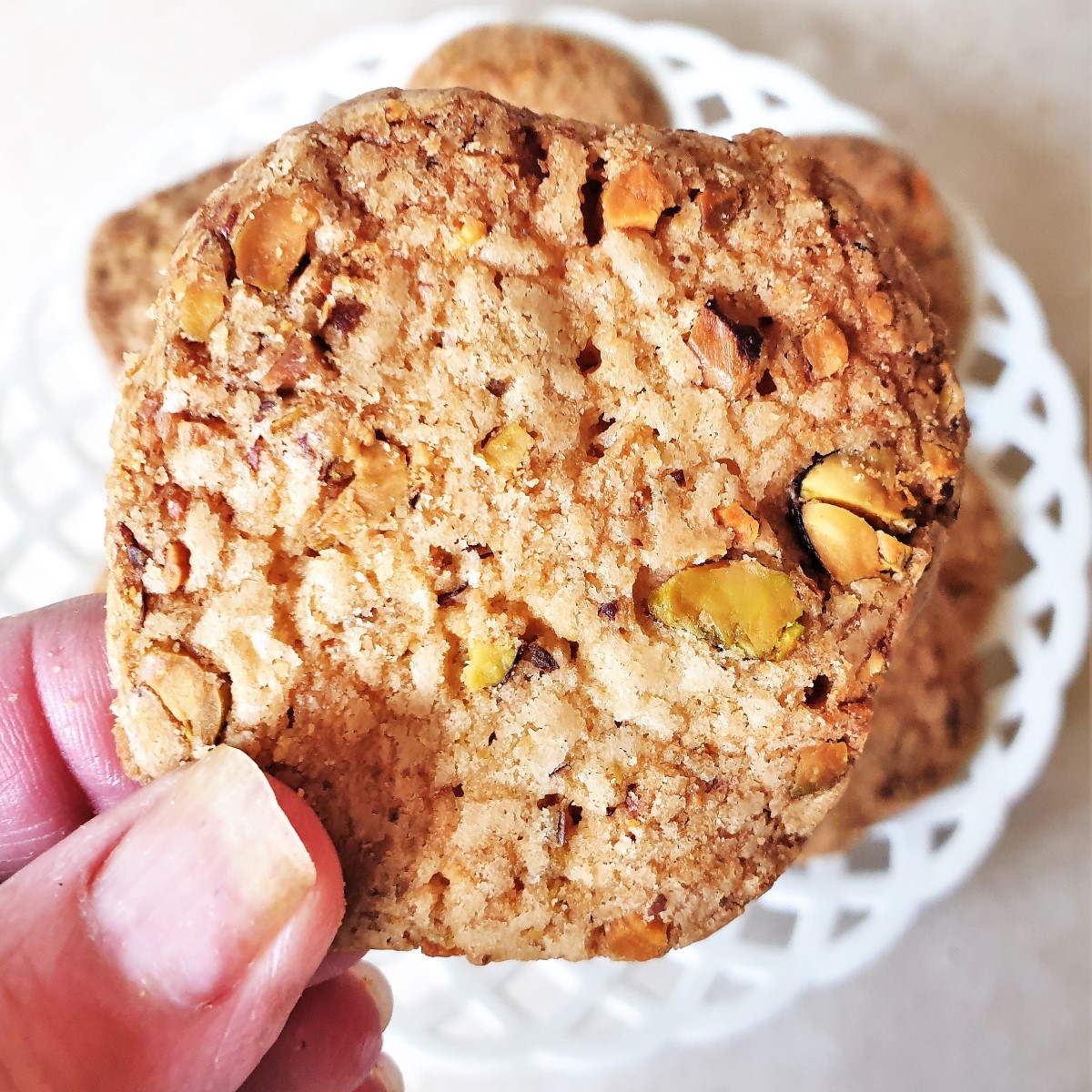 Close up of a pistachio butter biscuit.