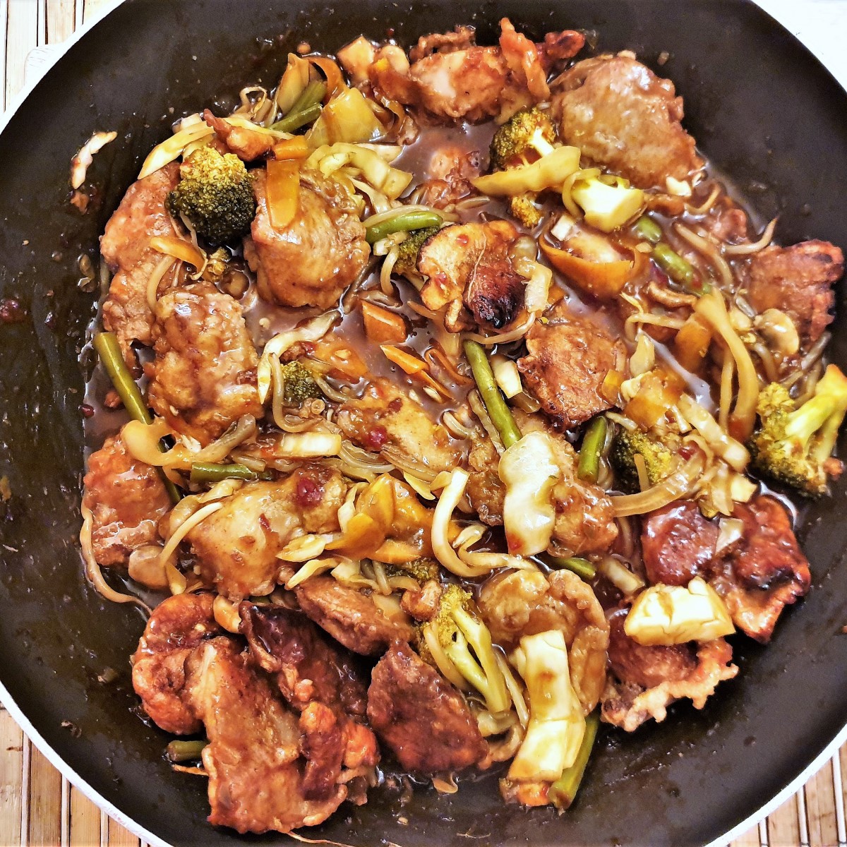 Chicken and vegetables in a wok.