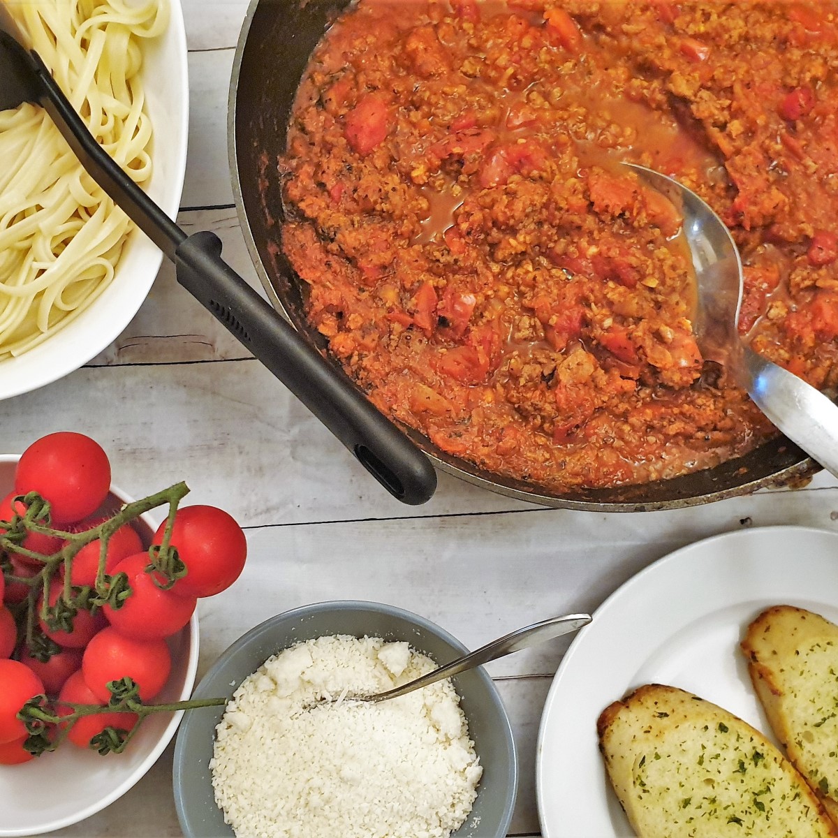 A pan of spaghetti bolognese sauce.