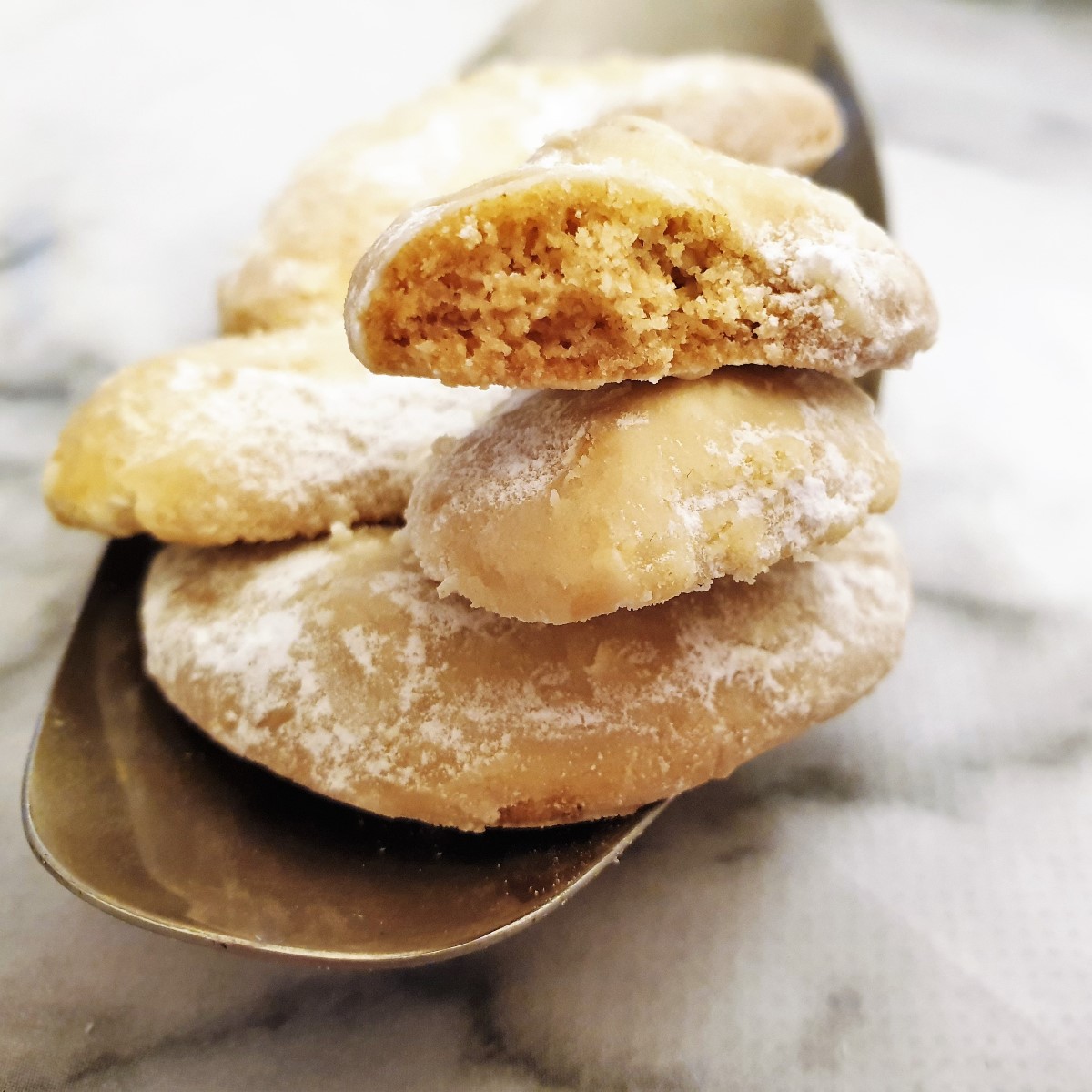 Close up of the inside of a walnut crescent cookie.