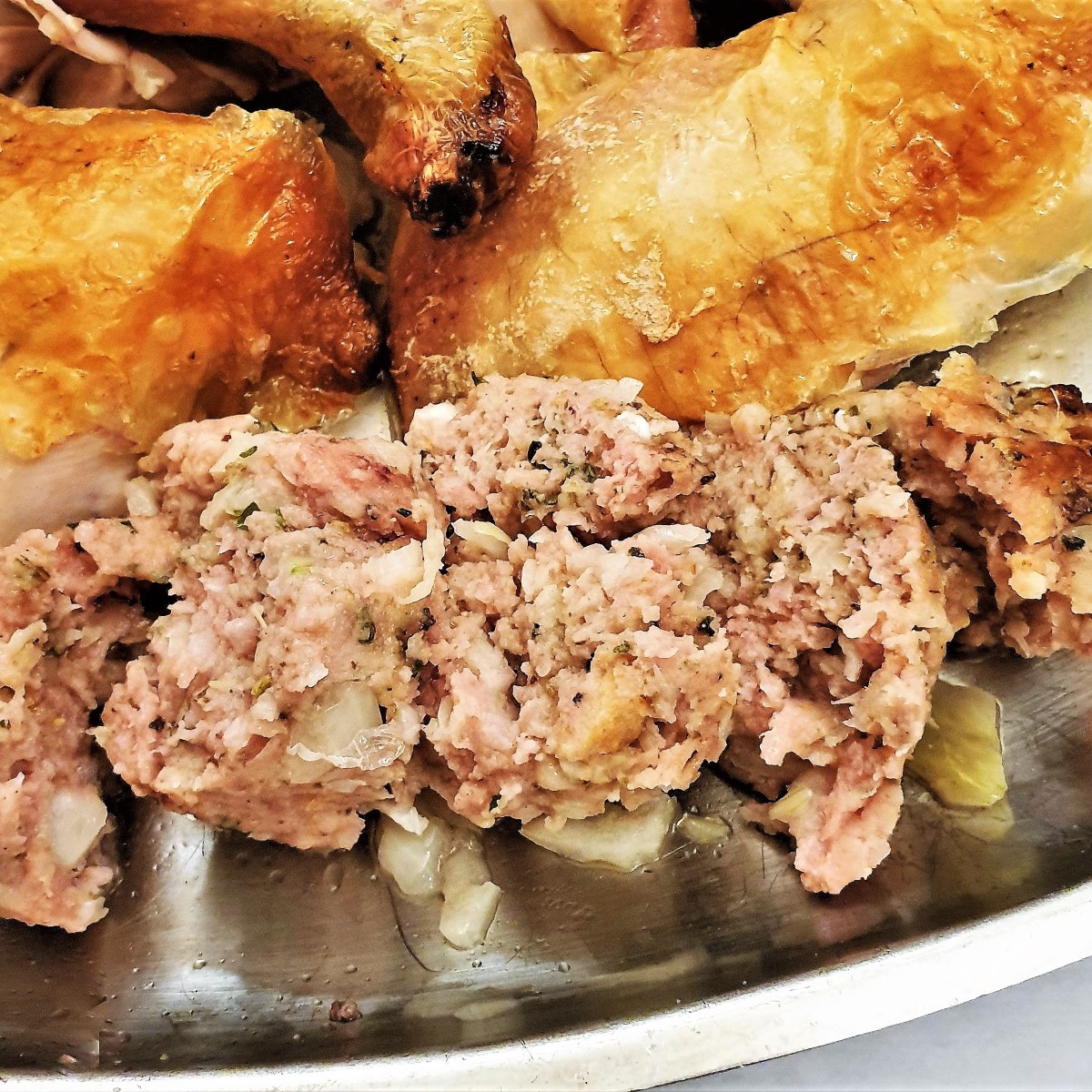Sliced sage and onion sausage meat stuffing on a plate. Sliced sage and onion sausage meat stuffing on a plate.