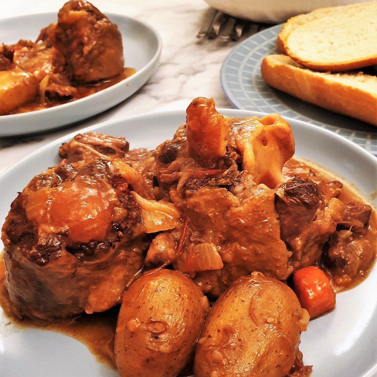 Closeup of a plate of oxtail stew.