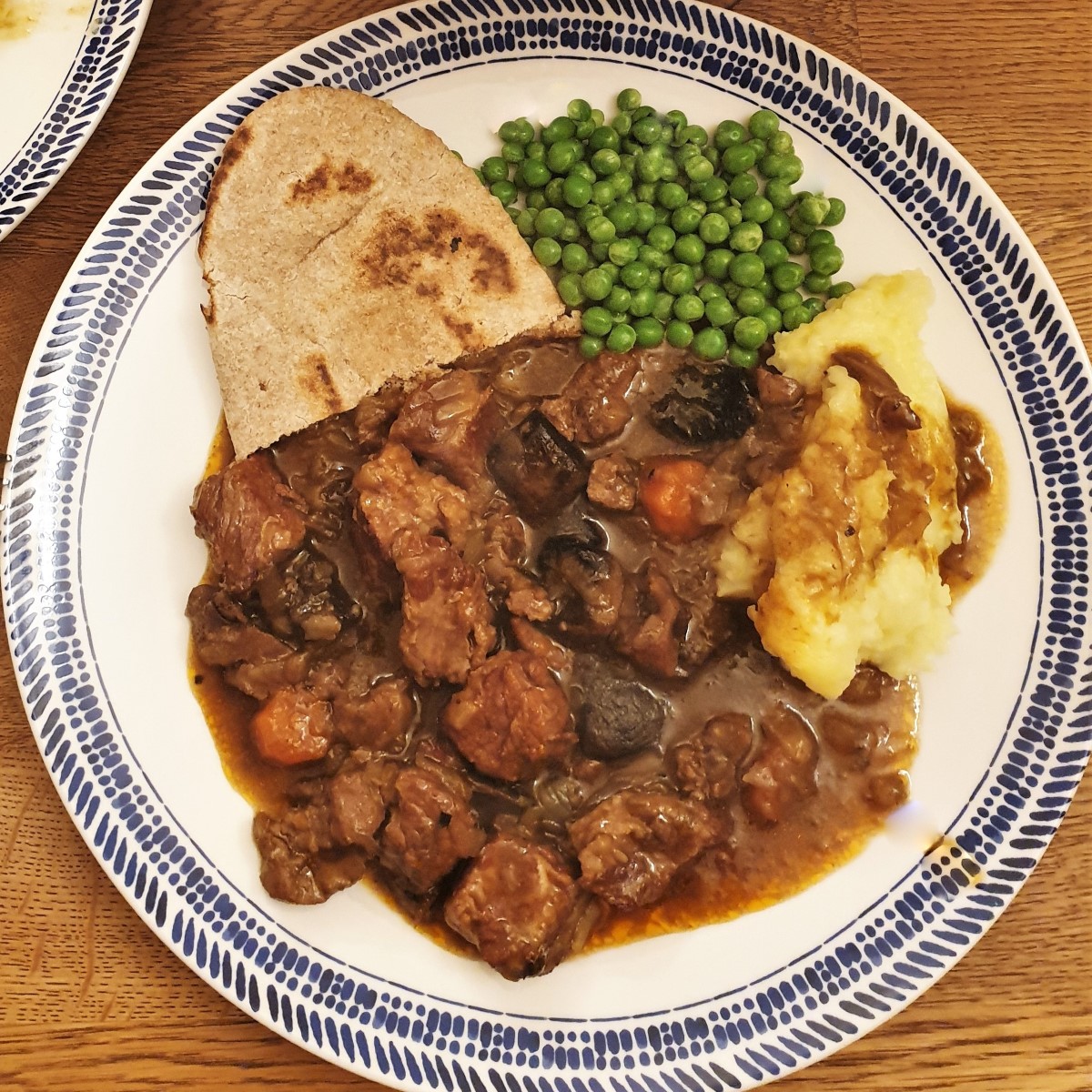A hearty beef and kidney stew, slow-cooked until you can cut the meat with a fork! And I've also got three secret tips for making the tastiest, thickest gravy, without the need for thickening agents. #foodleclub homemade #steakandkidney #beefstew #slowcookerstew Overhead shot of slow-cooker steak and kidney stew.