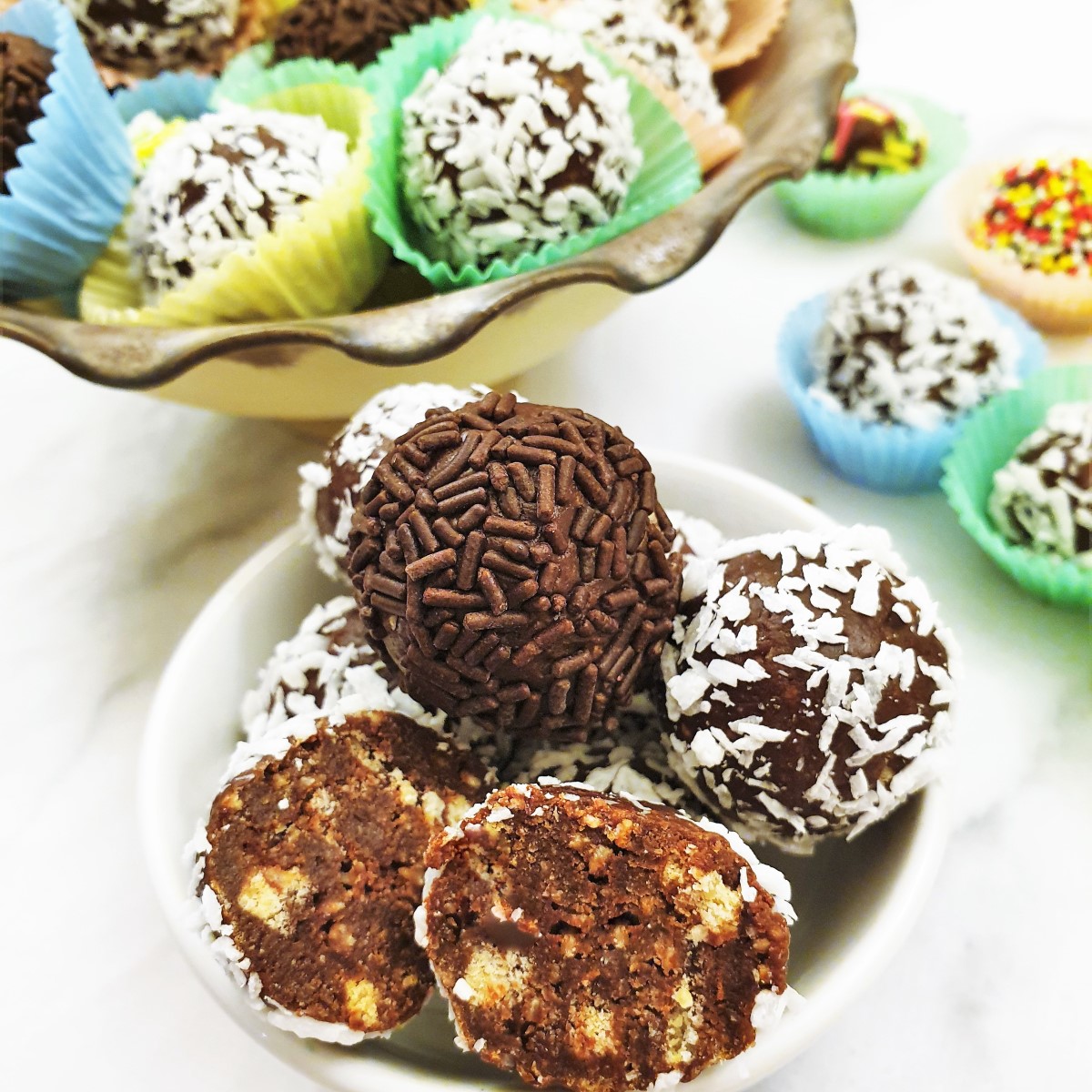 Close up of a chocolate truffle cut in half to show the inside.