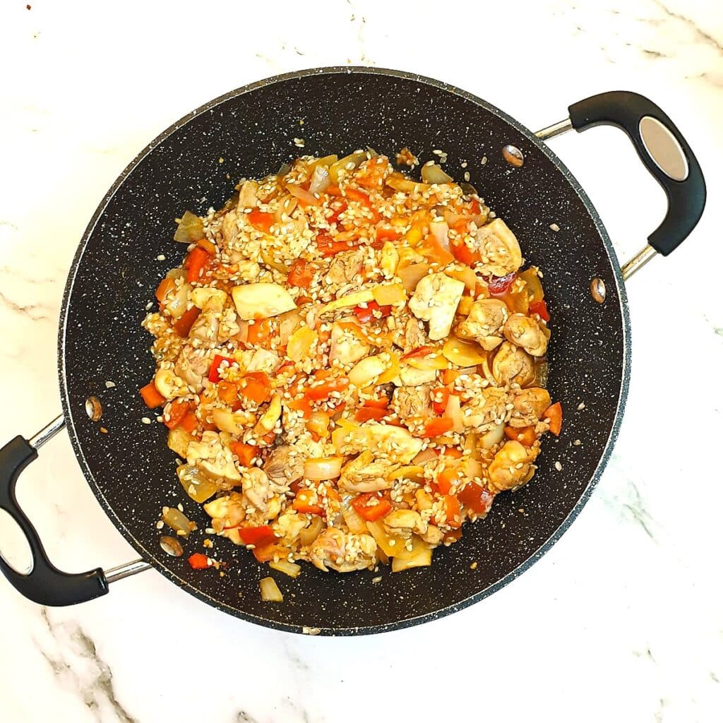 Paella, once the rice has been stirred in.