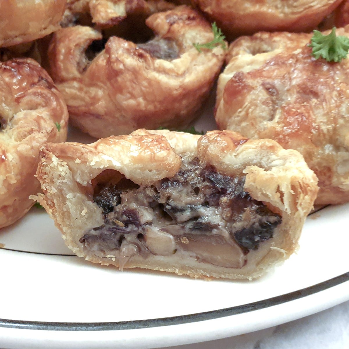 Close up of the inside of a mini mushroom tart.
