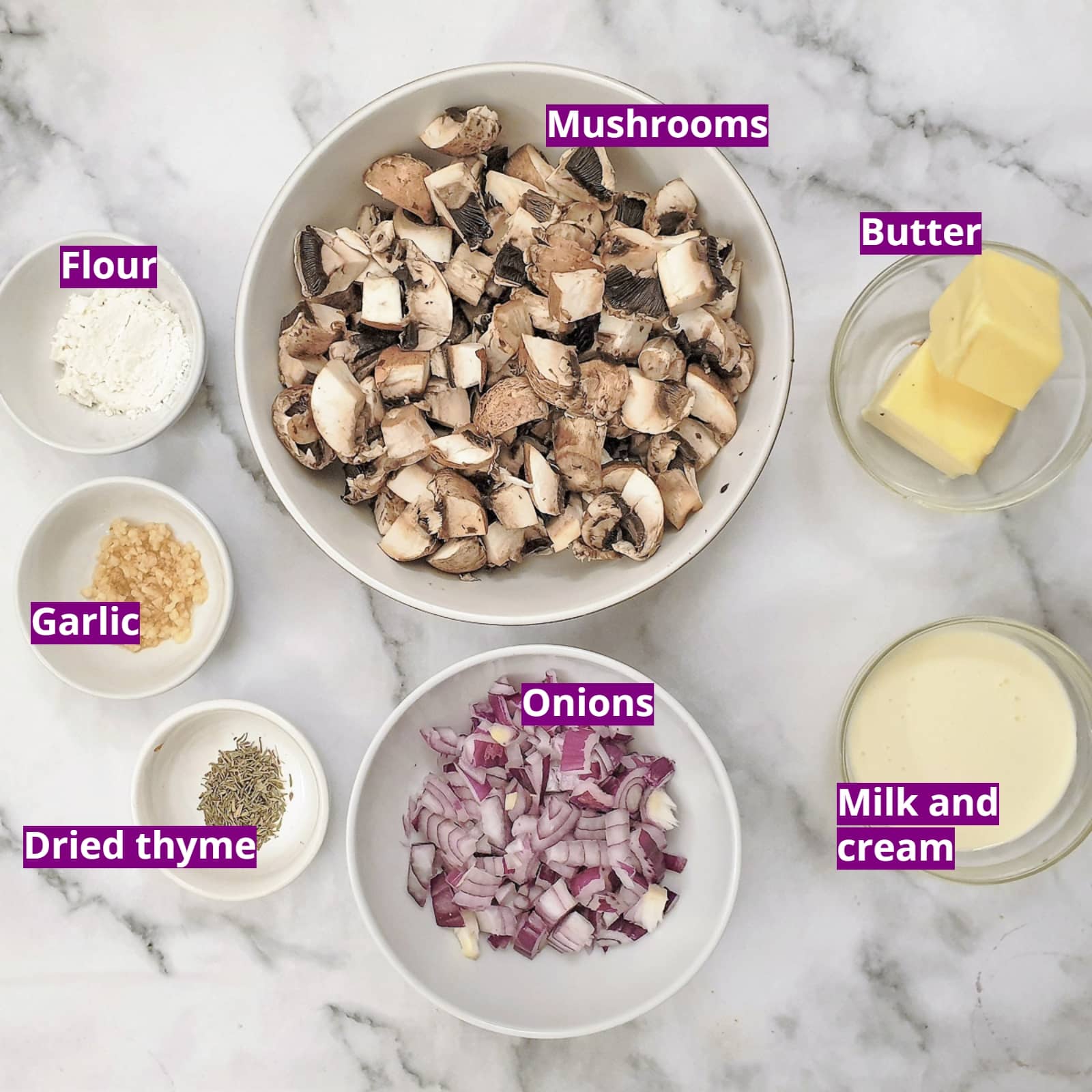 Ingredients needed to make mini mushroom puff pastry tarts. The roll of puff pastry hasn't been included in the image.