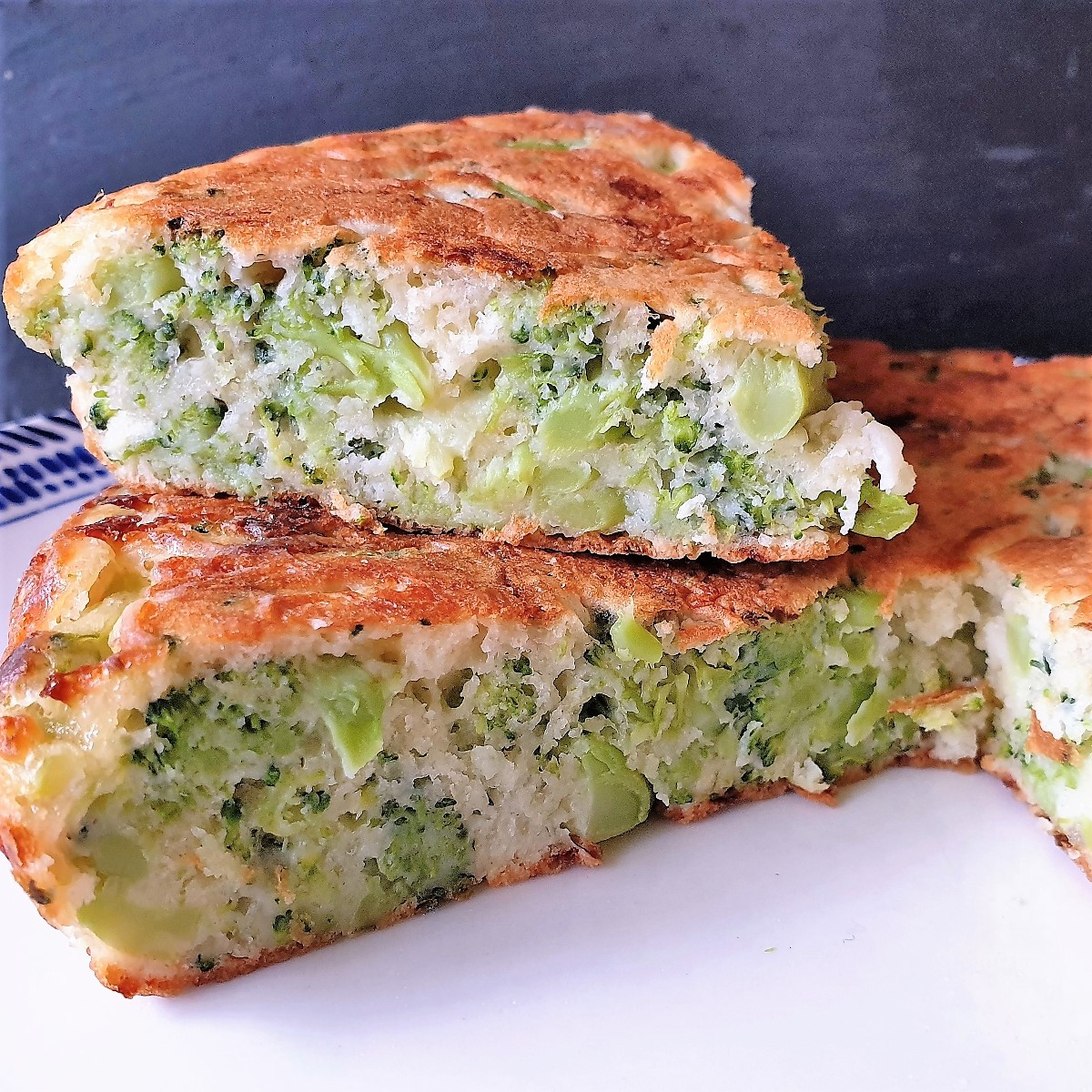 Closeup, showing the inside of the crustless broccoli and cheese tart.