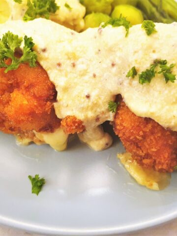 Crispy chicken cordon bleu covered with honey mustard sauce.