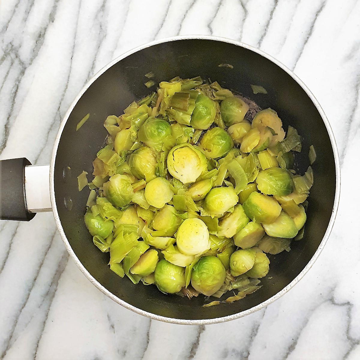 Add the brussels sprouts to the leeks.