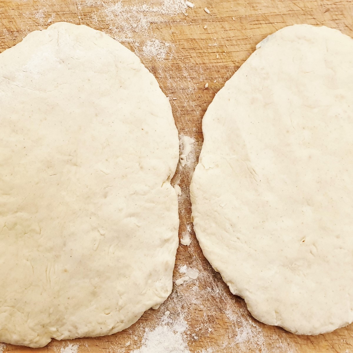 Flattened naan bread before being fried.