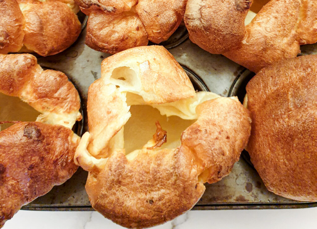 Close up of a Yorkshire pudding showing the perfectly formed hole in the centre.