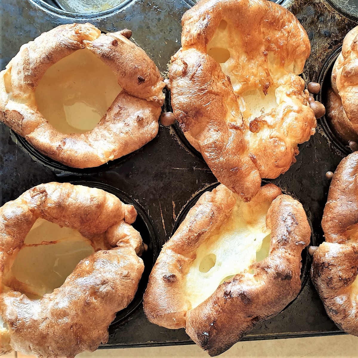 Yorkshire puddings in a muffin tin.